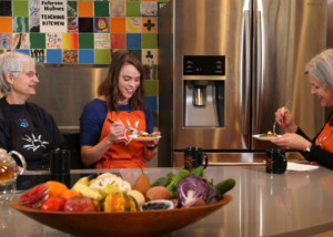 thumbnail for a patient education video featuring nutrition experts tasting healthy food in bright kitchen
