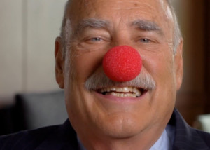 alumni giving video with planned giving donor chuck tatelbaum wearing red clown nose