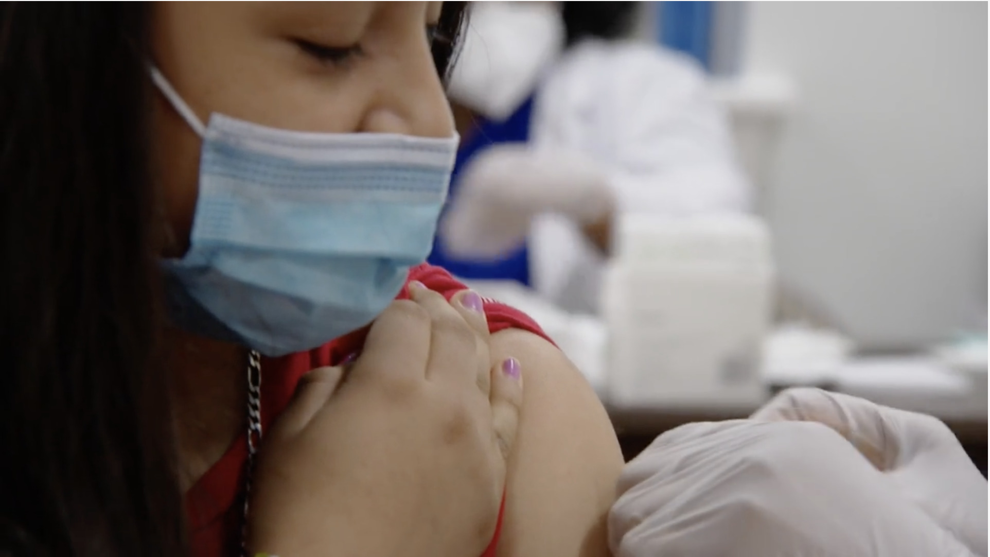 Young Latina being vaccinated Vaccinate with Confidence Campaign Video %page